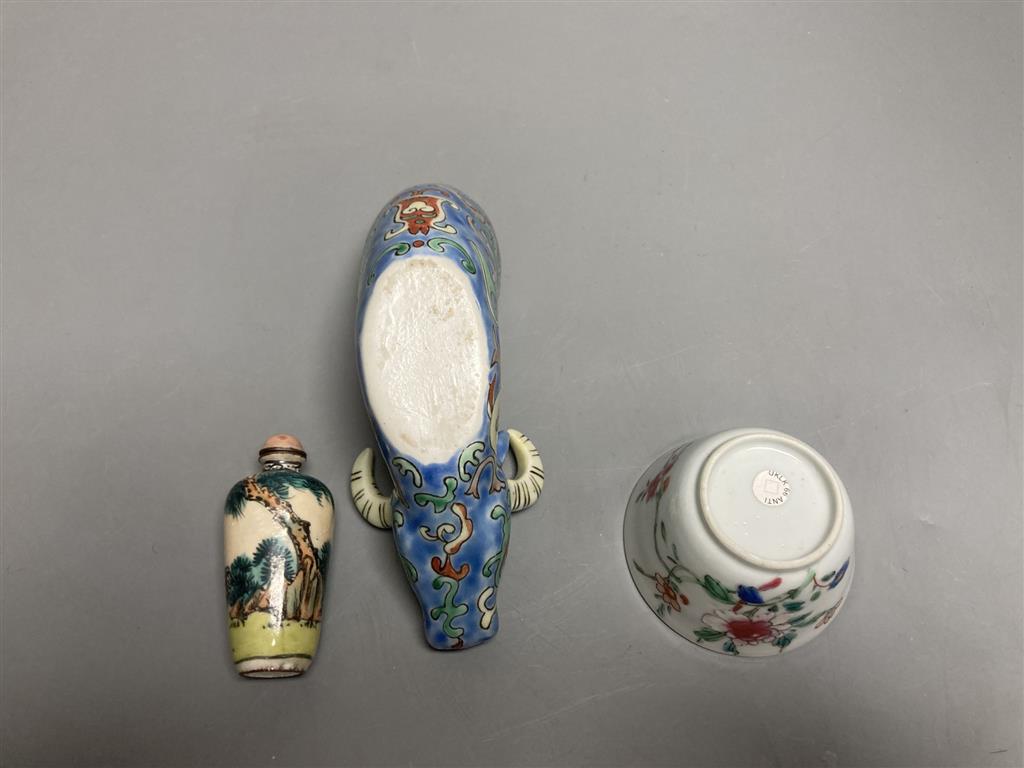 A Chinese famille rose cup, an ox rhyton cup and an enamel on copper snuff bottle